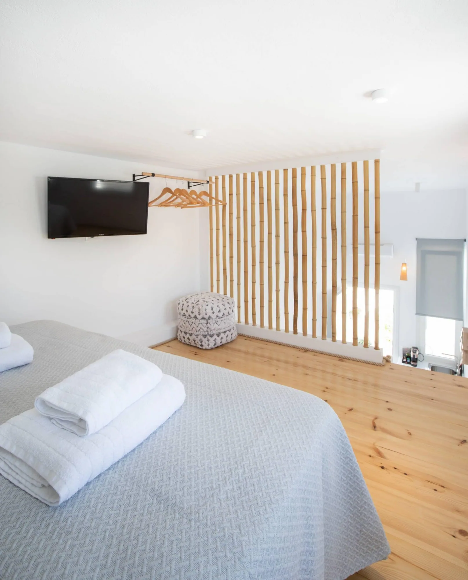 Deluxe Loft Suite · Loft bedroom with wooden slat balustrade